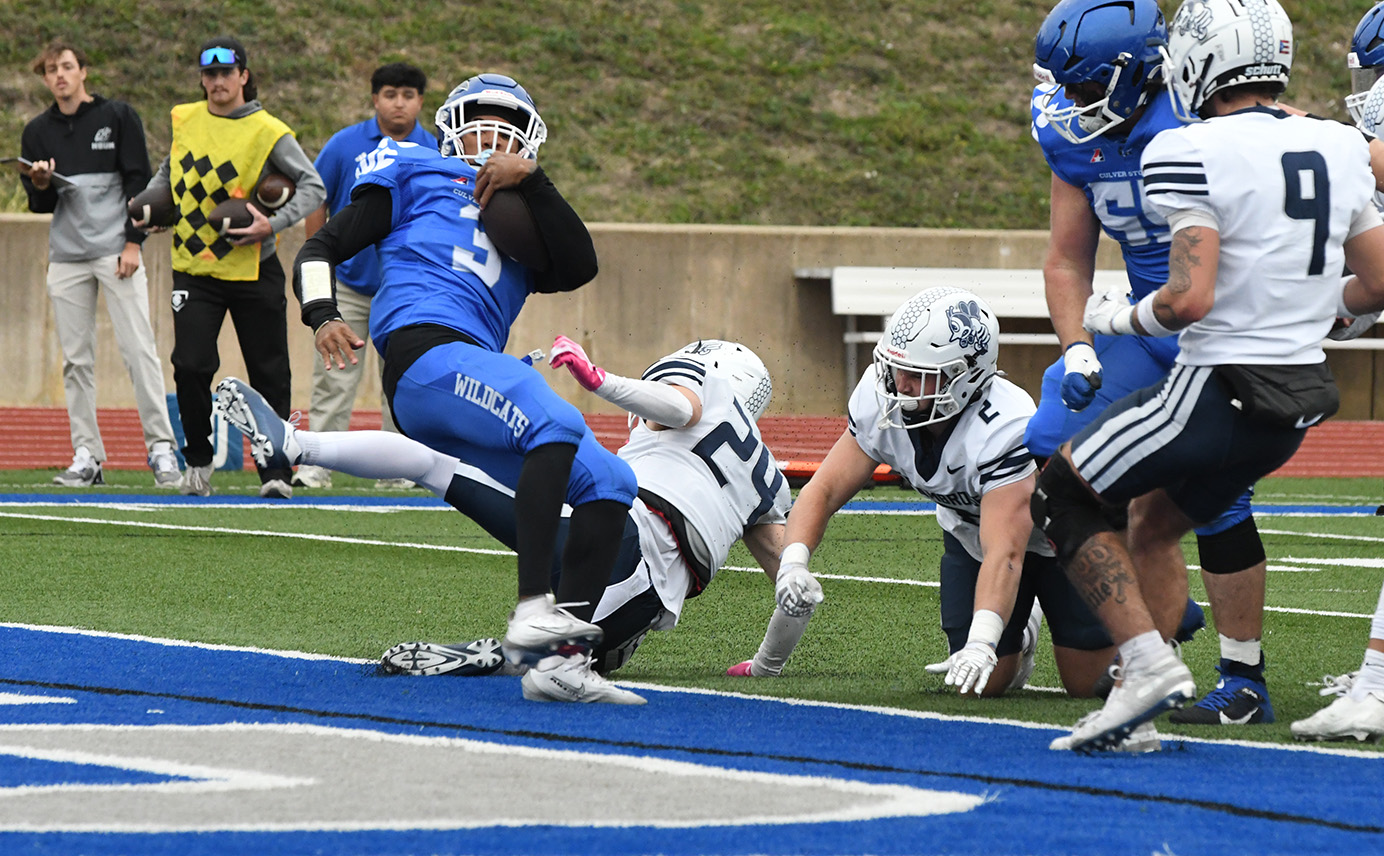 Ceylon Hughes fights his way into the end zone for the first touchdown of the day for he Wildcats. --- Photo by Lisa Wigoda.